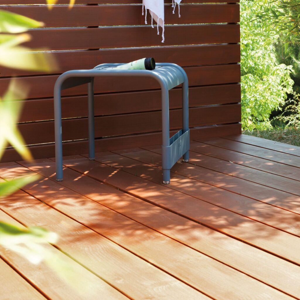 Wooden decking treated with V33 UV Resistant Decking Oil in Teak matt, providing water-repellent, microporous protection against UV rays and weathering.